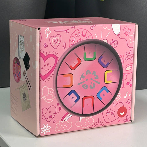 Introduce your little one to rhythm and colour with the Baby Pink box with colorful letter 'U' design on a gray background