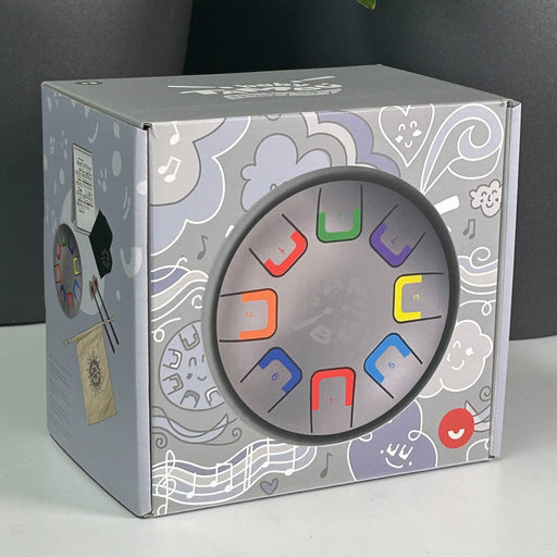 Introduce your little one to rhythm and colour with the Baby Product packaging with colorful design elements on a gray background