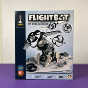 Box of JOYINCO Flightbot DIY wing launcher on a purple surface with a white background