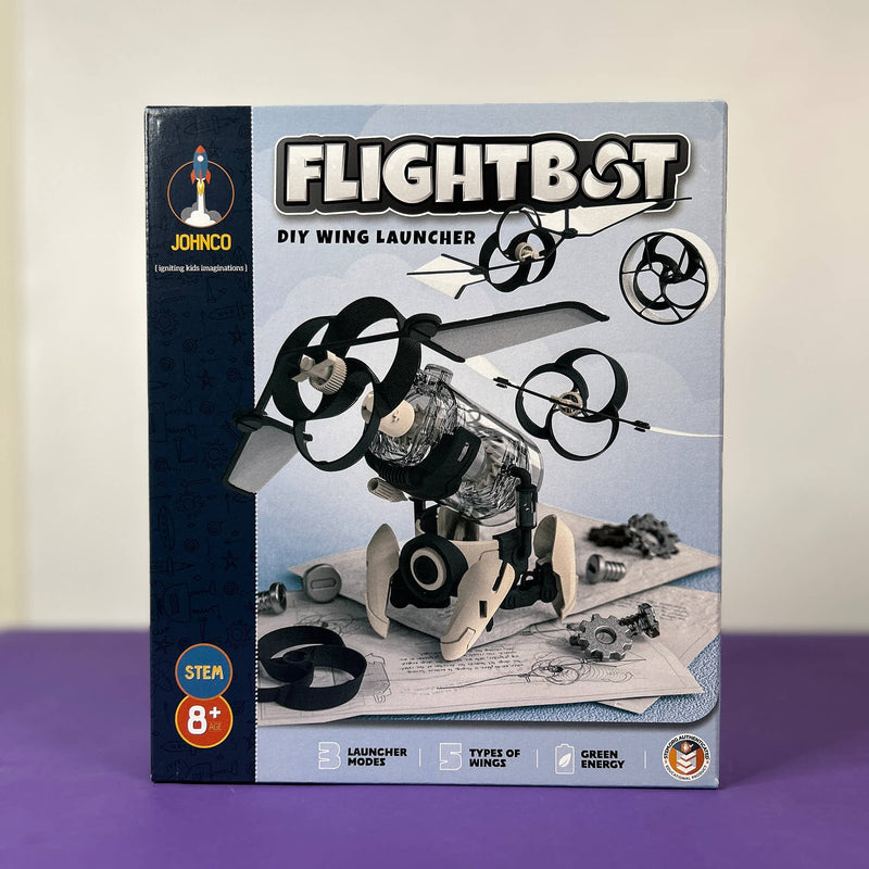 Box of JOYINCO Flightbot DIY wing launcher on a purple surface with a white background