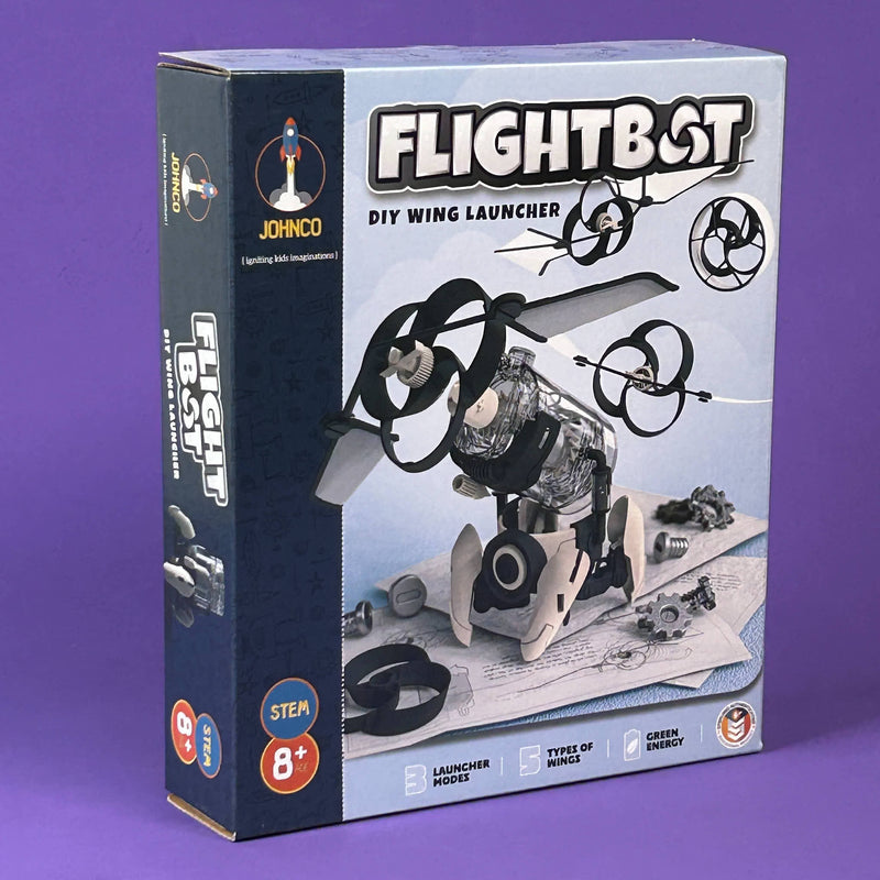 Box of 'FLIGHTBOT' DIY wing launcher toy on a purple background