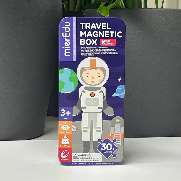 Travel Magnetic Box packaging with an astronaut illustration on a dark background