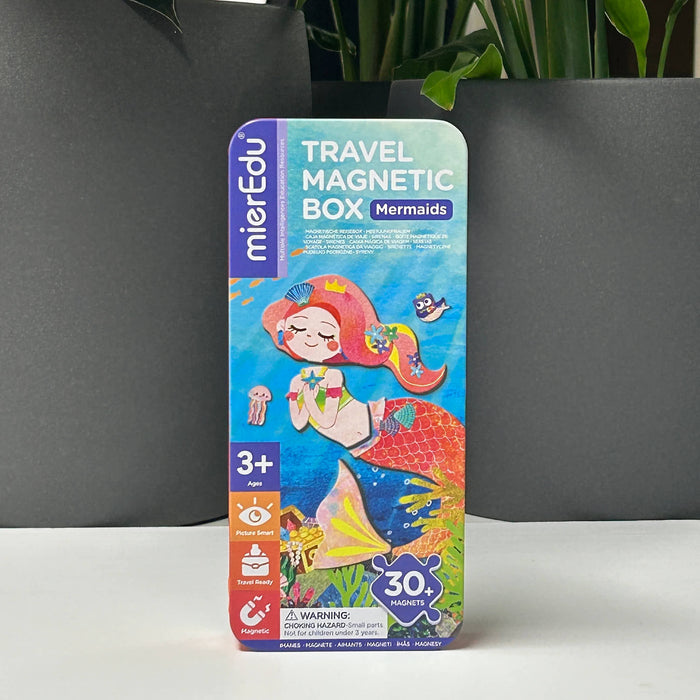 Travel magnetic box for mermaids with colorful packaging on a gray background