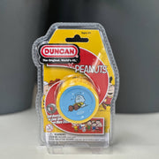 Duncan yoyo packaging featuring Peanuts characters on a gray background