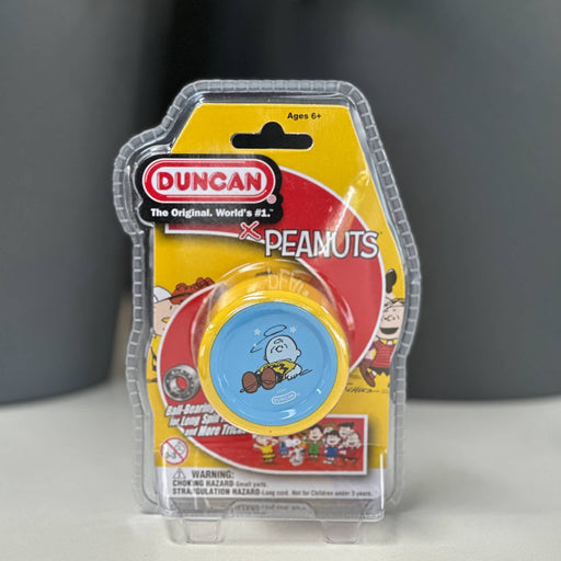 Duncan yoyo packaging featuring Peanuts characters on a gray background
