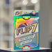 Flip7 card game packaging on a stand with a blurred background