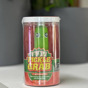 Pickle Grab toy packaging on a white surface with a gray background