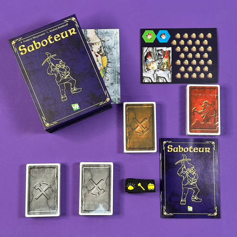 Saboteur board game components on a purple background