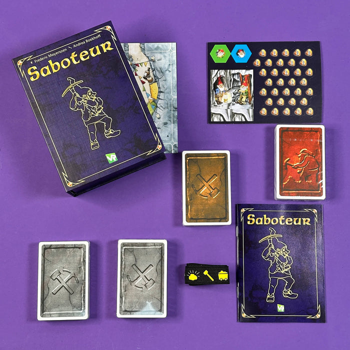 Saboteur board game components on a purple background