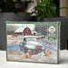 Cobble Hill puzzle box with a winter scene featuring a truck, dogs, and a barn.