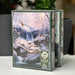 Cobble Hill puzzle box with a winter scene design on a white surface.