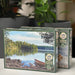 Cobble Hills puzzle box with a scenic design of a lake and boat, placed on a surface with a blurred indoor background.