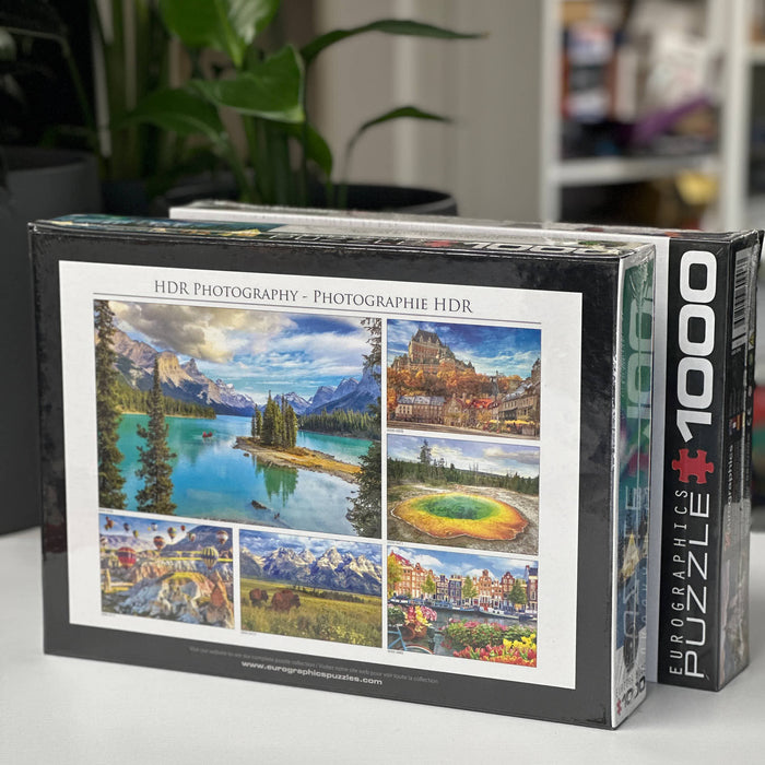 Jigsaw puzzle box with scenic images on a table