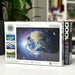Europressions puzzle box with Earth illustration on a white surface
