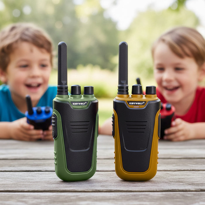 Two KIDYWOLF walkie-talkies standing upright on a wooden table, with two children holding other walkie-talkies blurred in the background outdoors.