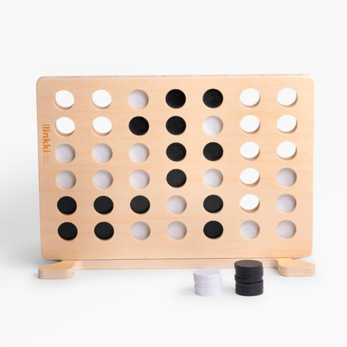 Wooden connect four game on a white background
