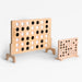 Wooden connect four game set on a white background