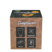A square cardboard box of Giant Sunflower seeds by Seeds of Change, featuring a brown leaf-patterned design with black icons indicating pot size, seeds, peat pellet, and instructions.