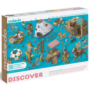 Makedo cardboard construction kit packaging with various cardboard models and 'Discover' text on a blue background.