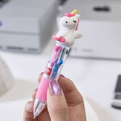 Crayon with a unicorn eraser held by a hand, with a blurred office background.