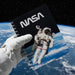 Notebook with NASA logo and astronaut image on a blue background