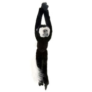 Plush monkey toy hanging on a white background