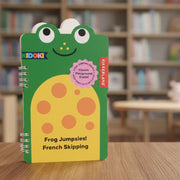 Frog-shaped notebook with a green border and yellow body, featuring Kikkerland branding.