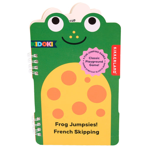 Frog-shaped notebook with a green border and yellow body, featuring Kikkerland branding.