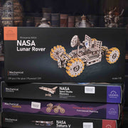 UGears NASA mechanical model boxes on a dark background
