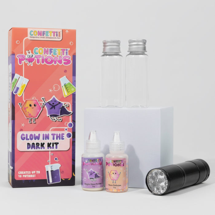 Glow in the dark kit with packaging, bottles, and flashlight on a white background