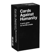 Black box of 'Cards Against Humanity' game with white text on a white background