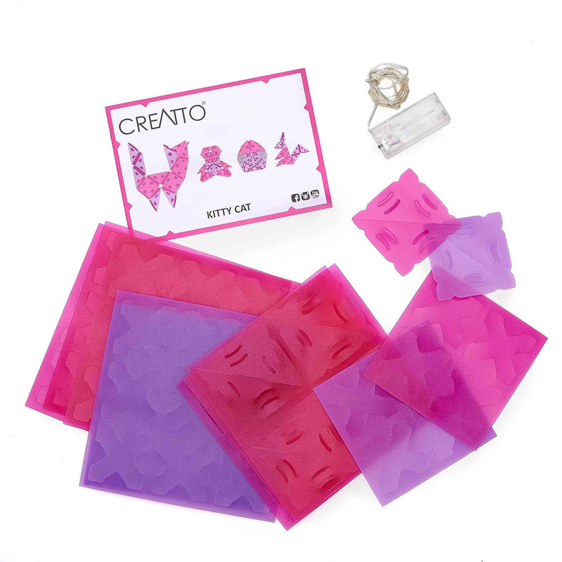Set of pink and purple silicone molds with a 'Creatto' brand card on a white background