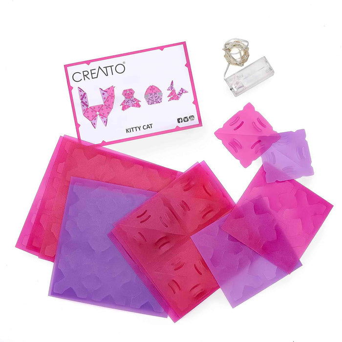 Set of pink and purple silicone molds with a 'Creatto' brand card on a white background