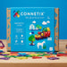 Connetix magnetic tiles packaging with colorful design and toy illustration on a table
