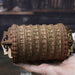 Ugears Escapewelt Cryptex Wooden letterpress wheel held in a hand with a blurred background