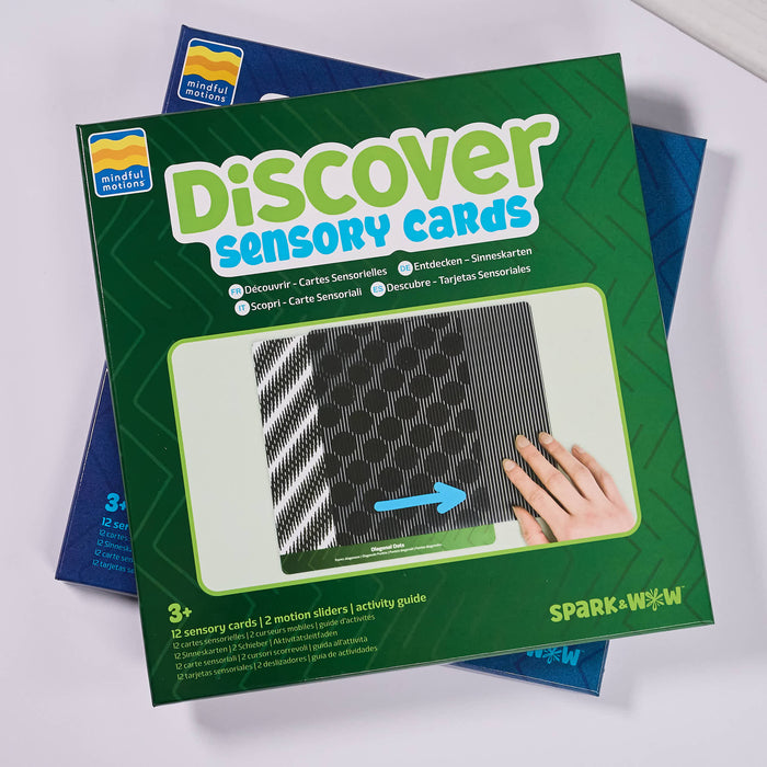 Discover Sensory Cards by Spark & Wow, shown in its green and blue retail box with a photo window displaying the cards and a hand interacting with them.