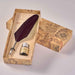 Feather pen and ink bottle set in a decorative box with world map design