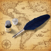 Feather quill pen with ink bottle and inkwell