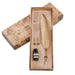 Gold feather quill pen set with ink bottle in a decorative box on a white background