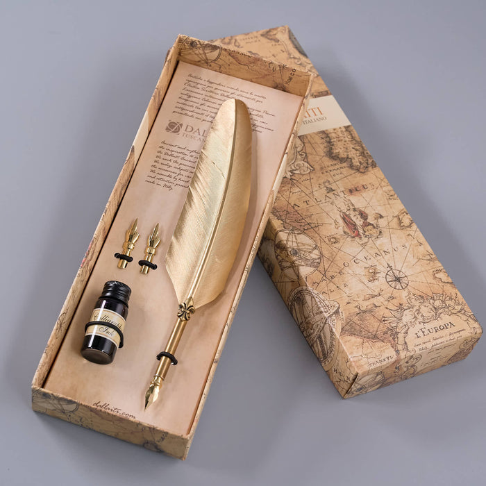 Feather pen set with ink bottle in a decorative box on a wooden surface