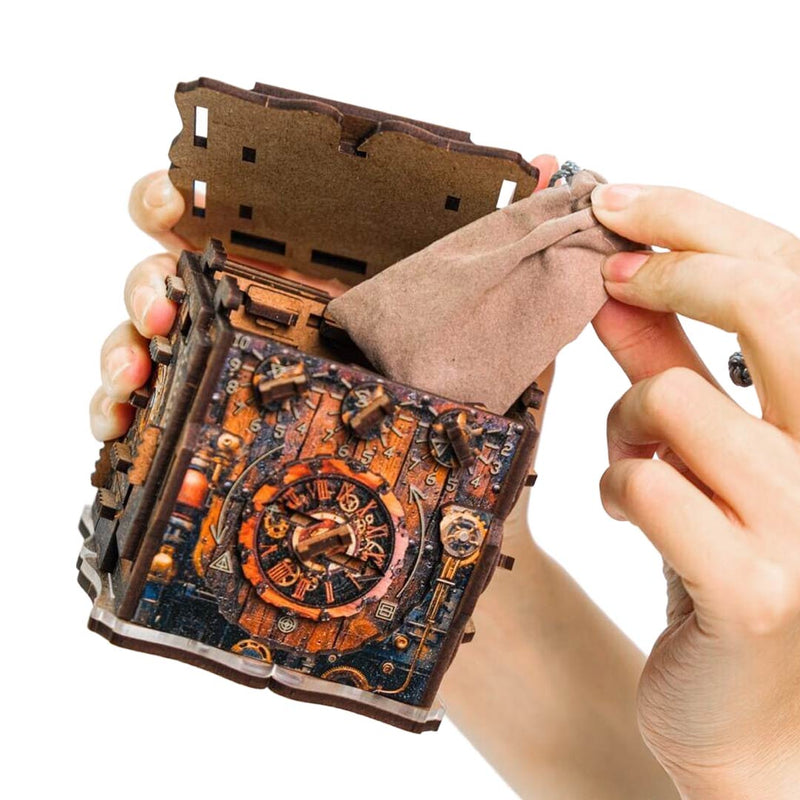 Ugears Iqube Dark logic game  Hand holding a detailed model of a mechanical device with intricate design