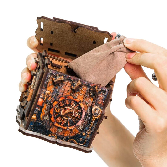 Ugears Iqube Dark logic game  Hand holding a detailed model of a mechanical device with intricate design