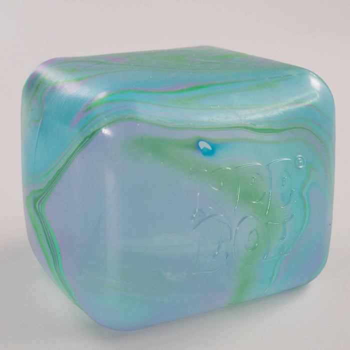 Marbled green and blue cube swirl needoh 'Kinder Joy' branding on a white background