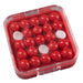 Red and white round candies in a clear plastic container on a white background