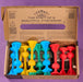 Colorful hourglass-shaped toys in a cardboard box with branding text. Cardboard packaging of TOSSIT product with colorful elements and text.