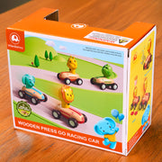 Wanbourns wooden press go racing car packaging on a wooden surface