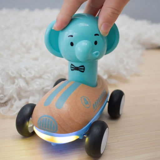 Toy car with elephant design on a wooden surface