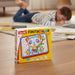 Fantacolor toy packaging on a table with a child playing in the background