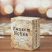 Box of 'Ransom Notes' game on a wooden surface with blurred background