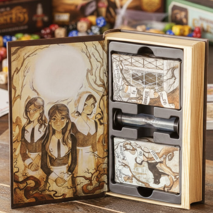 Wooden book-shaped box with illustrations and compartments on a wooden surface